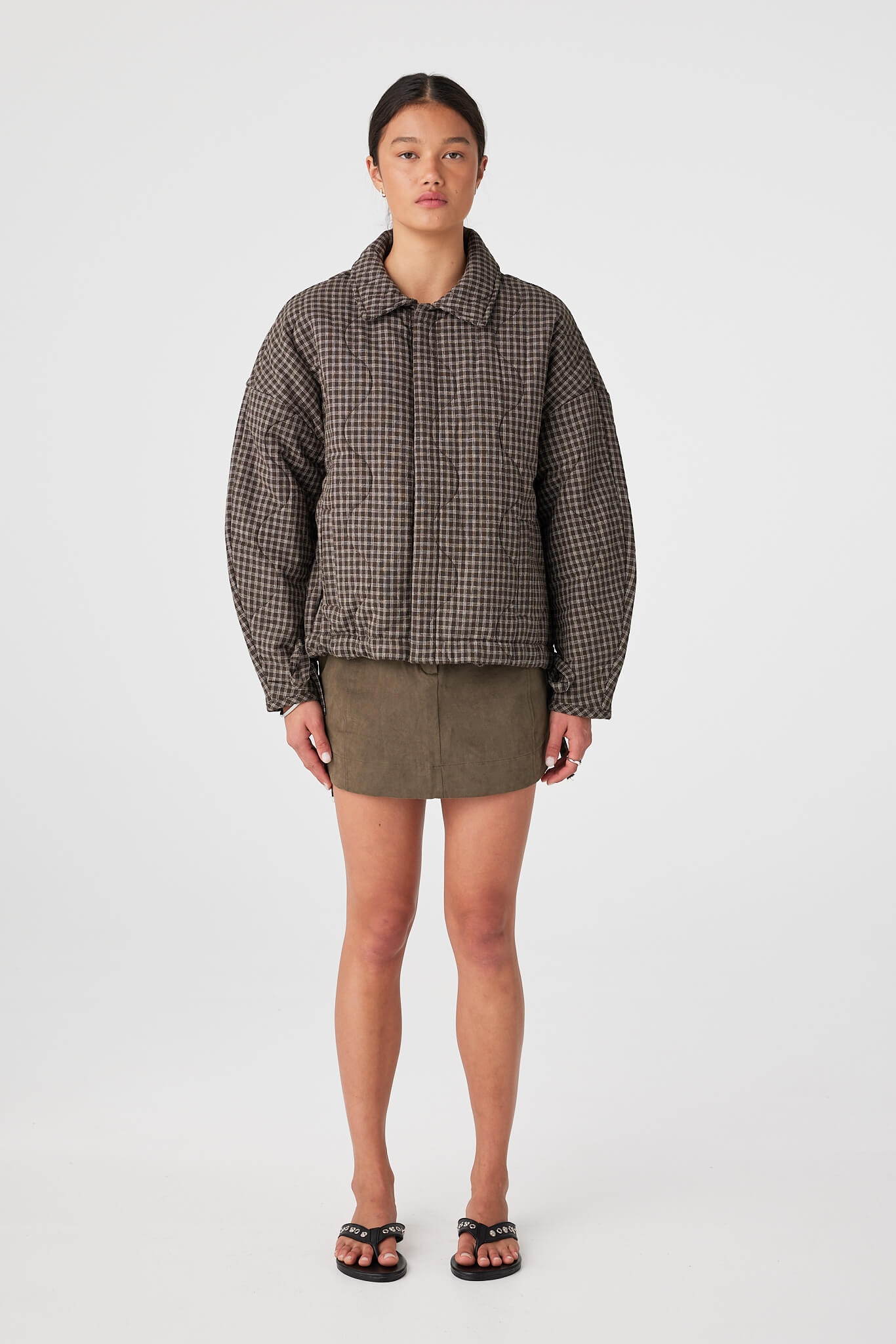 Full-body studio shot of quilted cotton jacket in Espresso Check with slouchy fit and drawstring hem