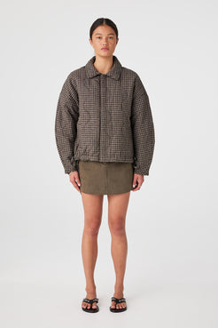 Full-body studio shot of quilted cotton jacket in Espresso Check with slouchy fit and drawstring hem