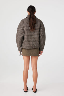 Back view of Espresso Check quilted jacket showing relaxed width and hemline drawstring detail