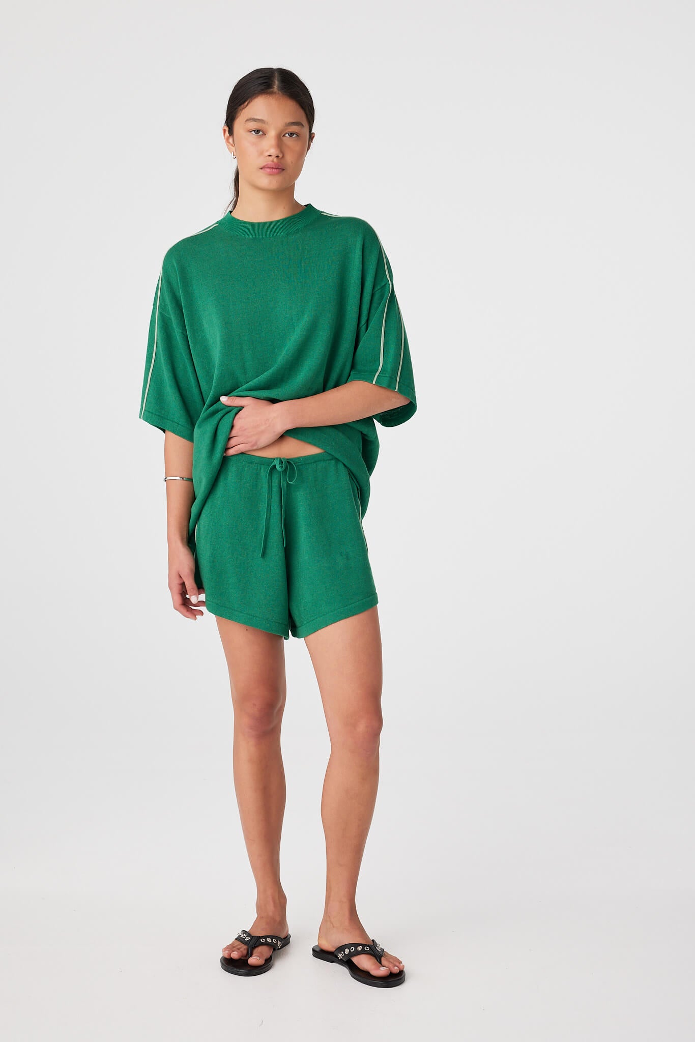Relaxed-fit sea green shorts with contrast side stripe and adjustable drawcord waist.