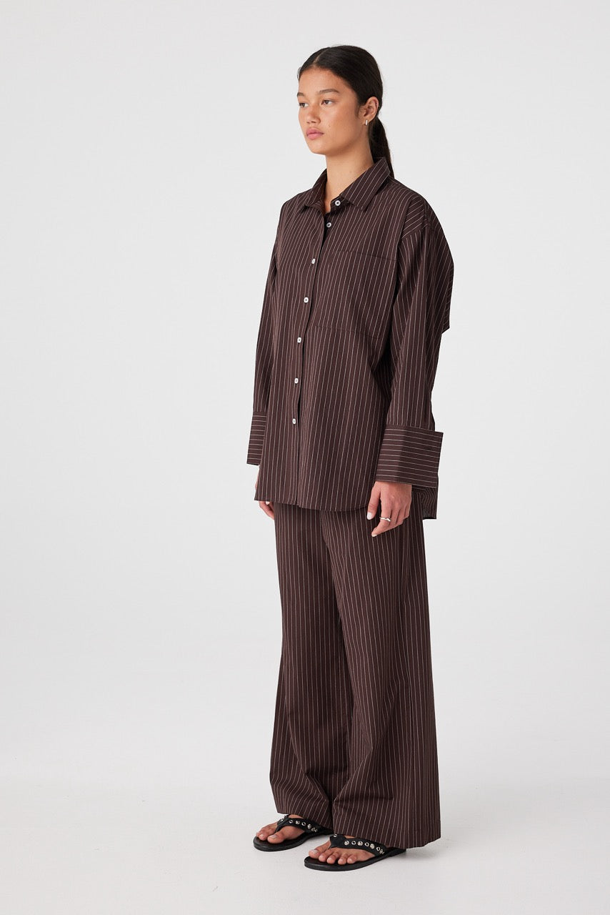 Model wearing Rae Pants with matching shirt, styled open for relaxed movement