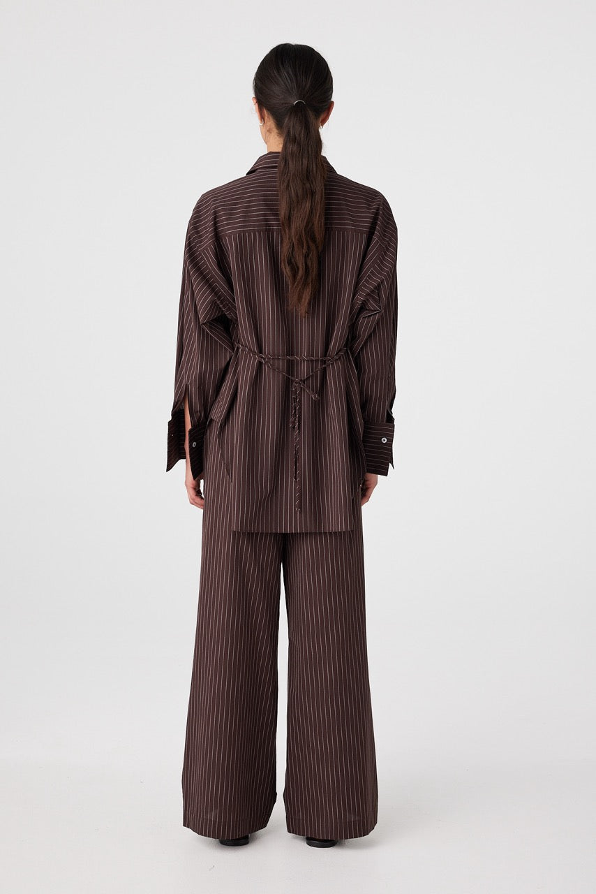 Relaxed fit shirt in espresso stripe cotton, showing movement and oversized volume
