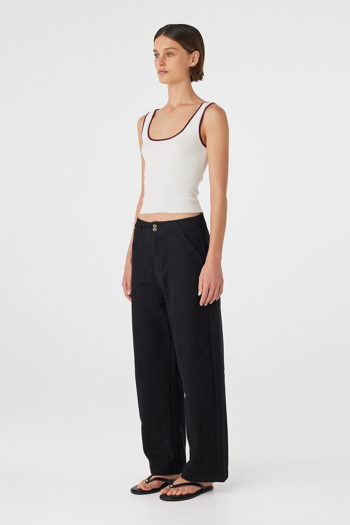 Side view of Kaya Tank cream and merlot, slim-fit organic cotton knit tank with contrast neckline and armholes.