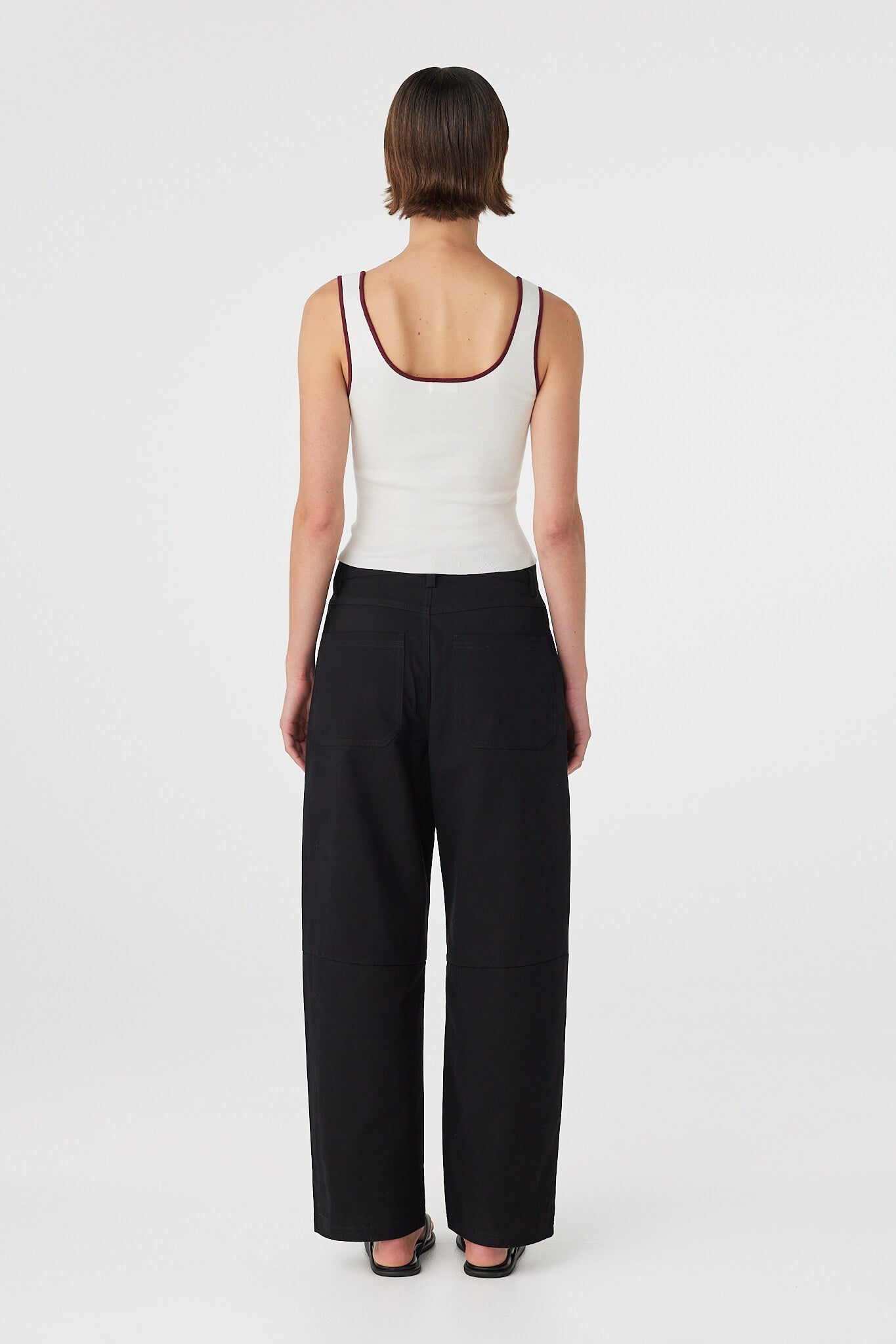 Back view of Kaya Tank cream and merlot, organic cotton knit tank showing clean back line and contrast binding.