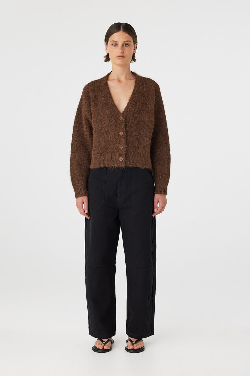 Full body front view of brown cardigan paired with black pants