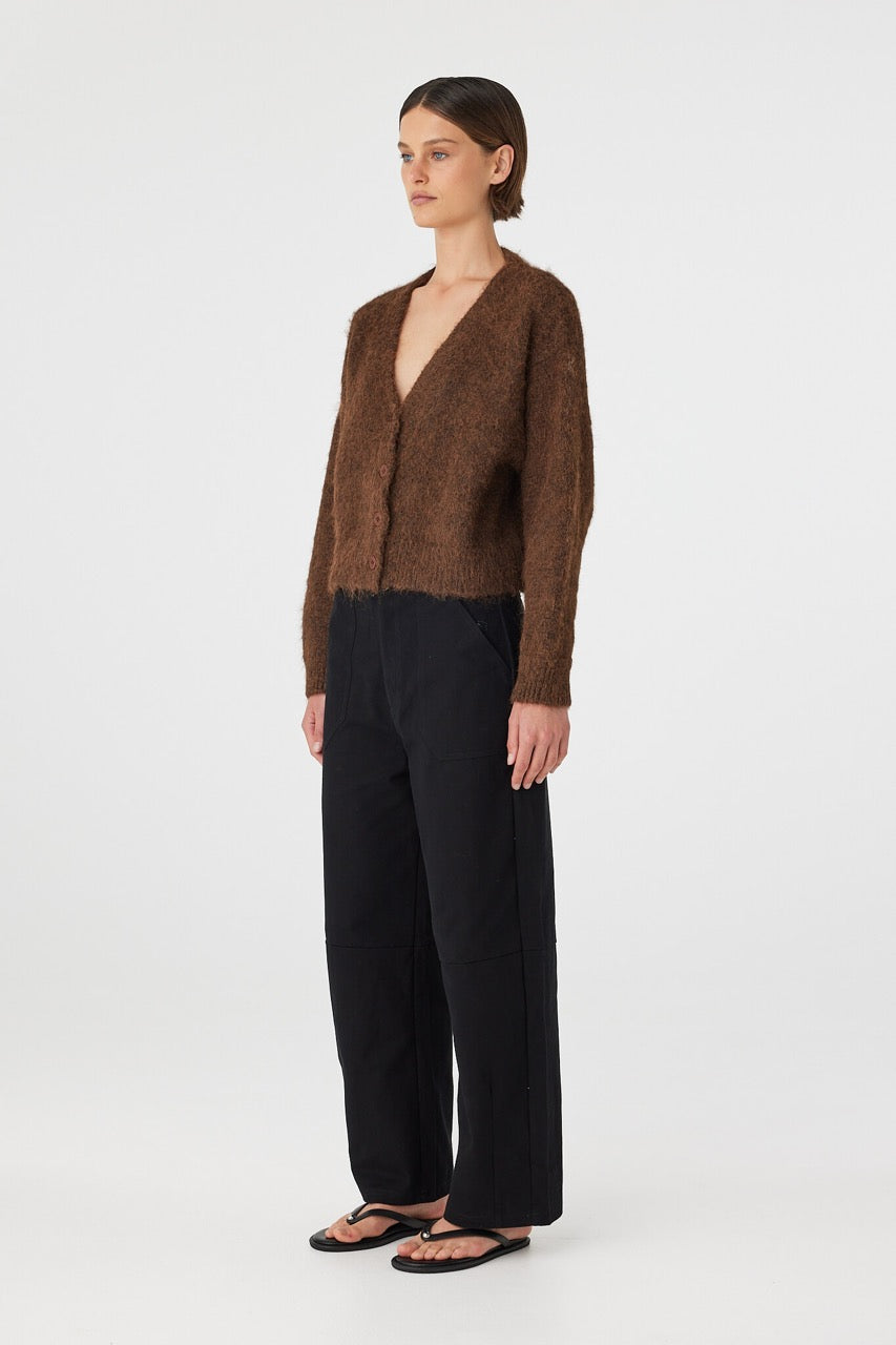 Side view of brown cardigan showing dropped shoulder and relaxed shape