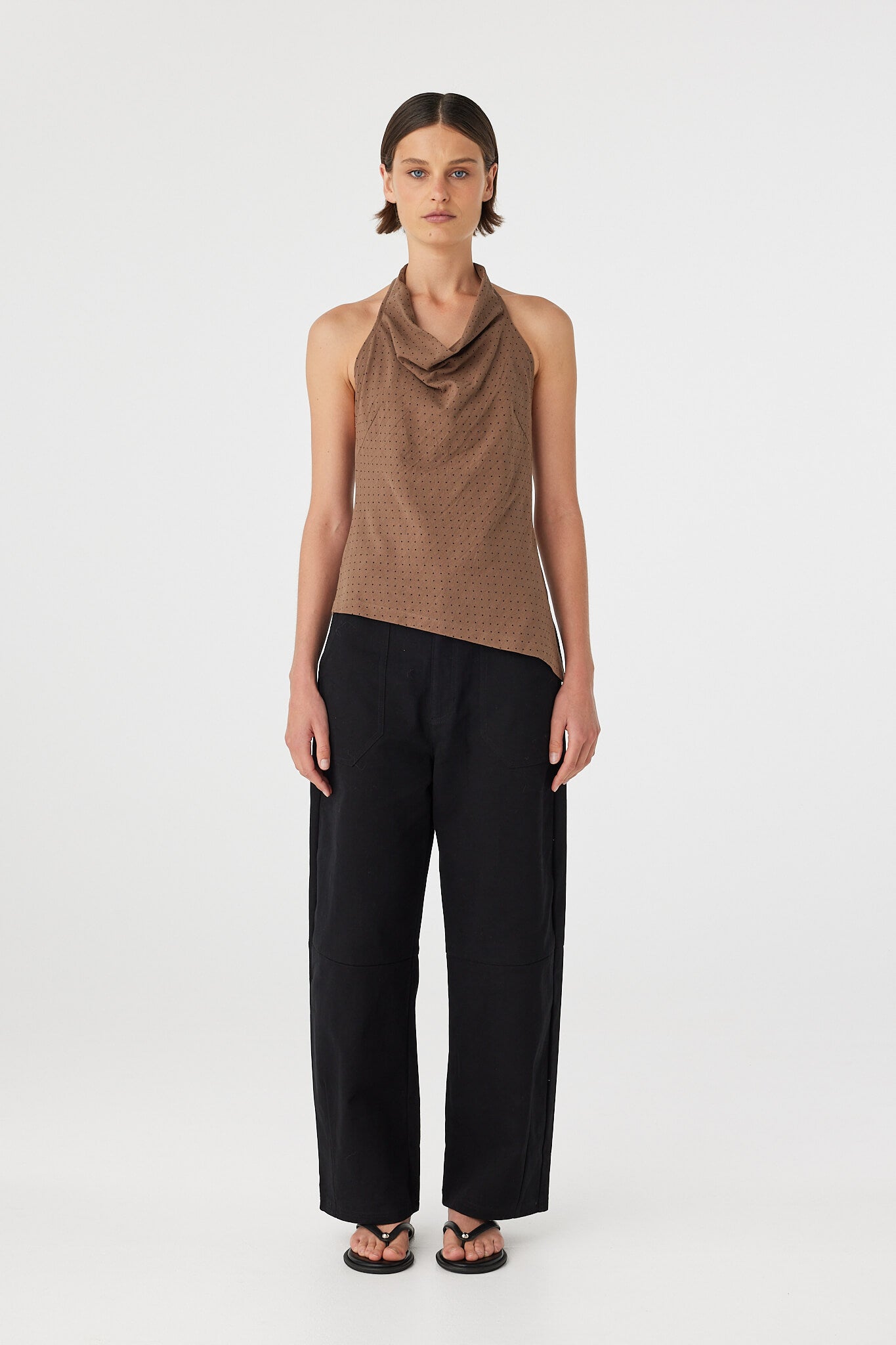 Full look: Alessia Top choc polka dot cotton halter top with cowl neckline, paired with black pants, front view.
