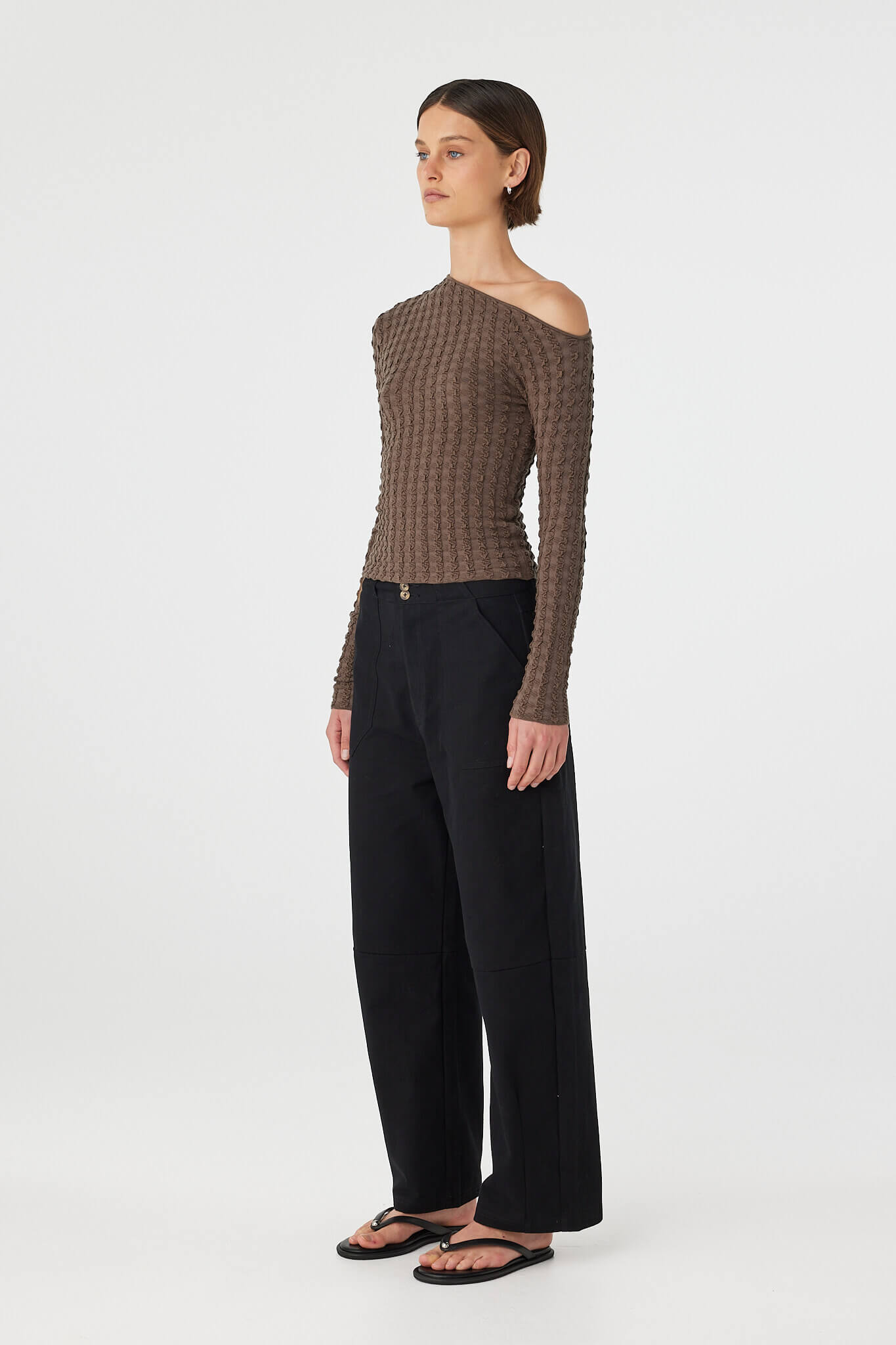 Side view of Sedona long sleeve top in Pavement showing close fit and sleeve length