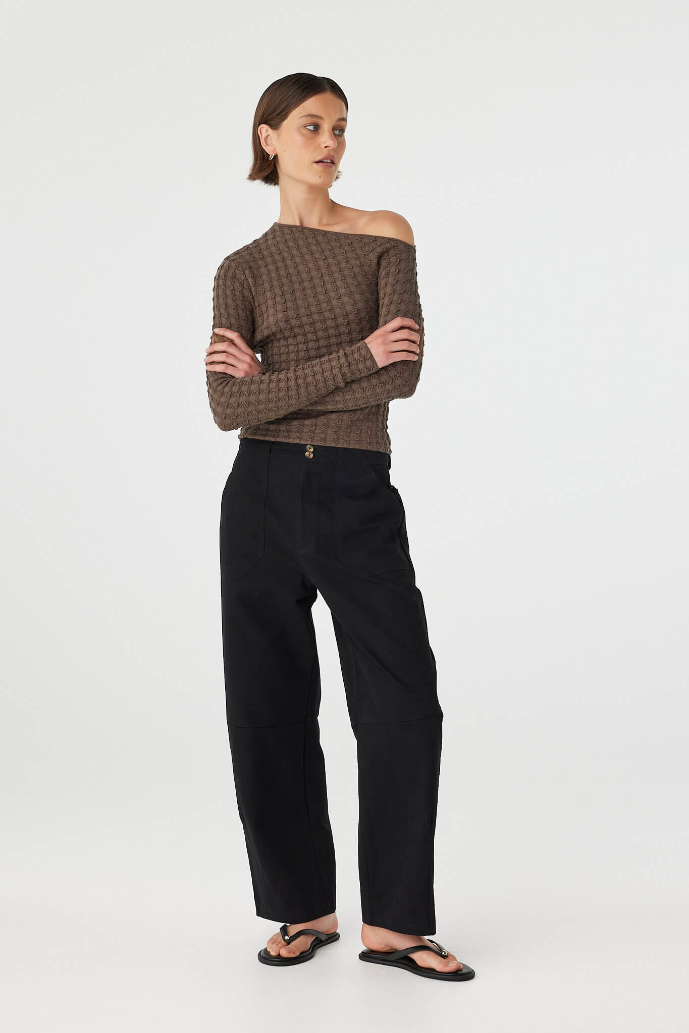 Angled front view of Sedona long sleeve top in Pavement showing asymmetrical neckline and texture
