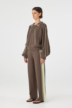 Side view of Nella sweater in pavement showing raglan sleeves and piping detail