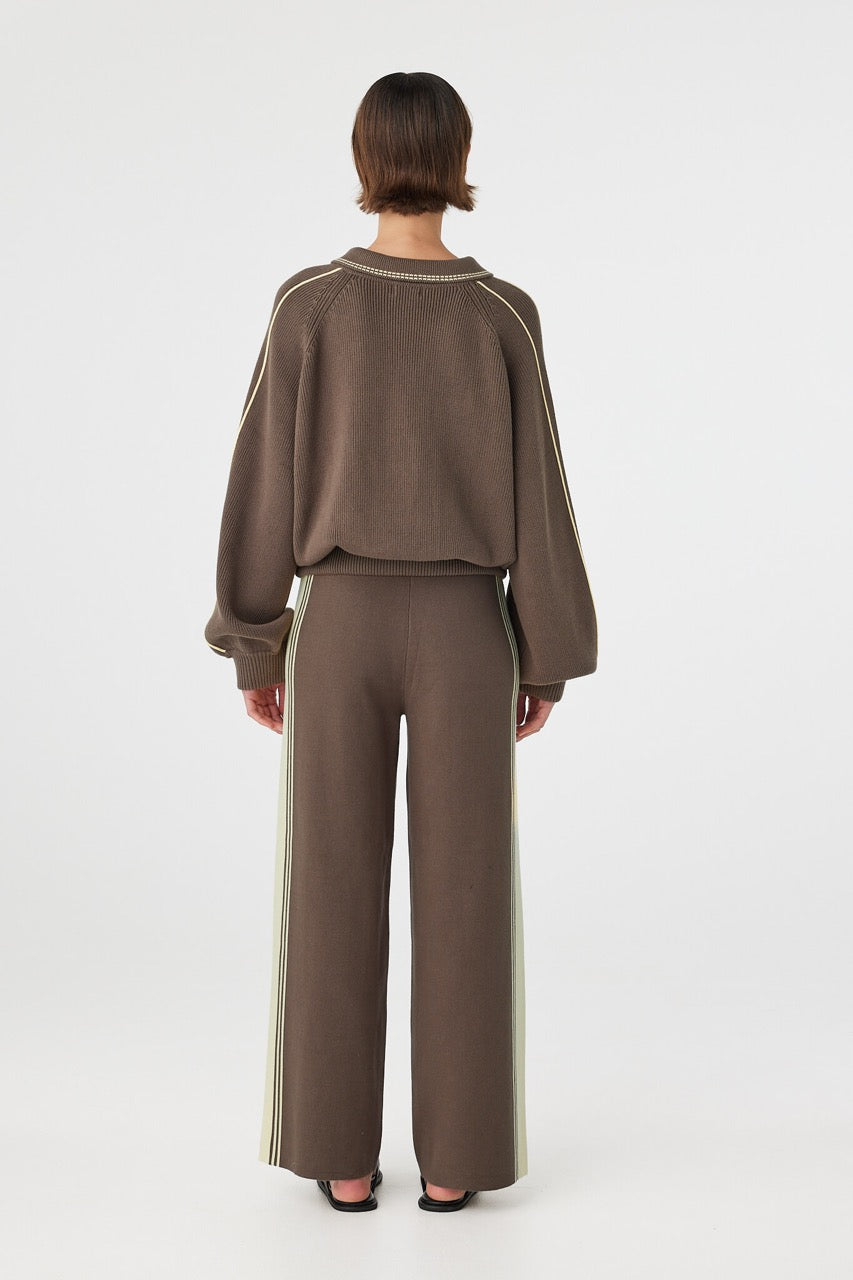 Back view of brown sweater with elasticated ribbed waistband