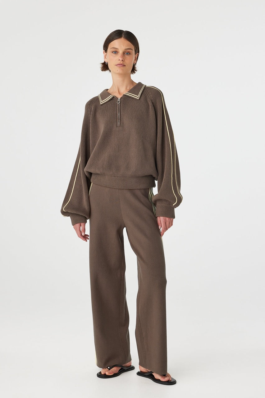 Front view of brown sweater with 1/4 length metal zip and contrast collar