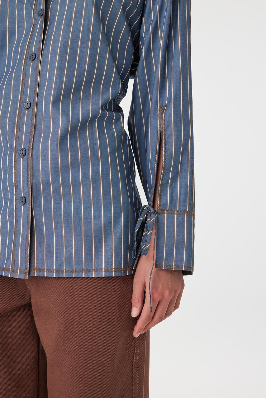 Cuff detail of Blair Shirt muted blue stripe, oversized cuff with adjustable tie.