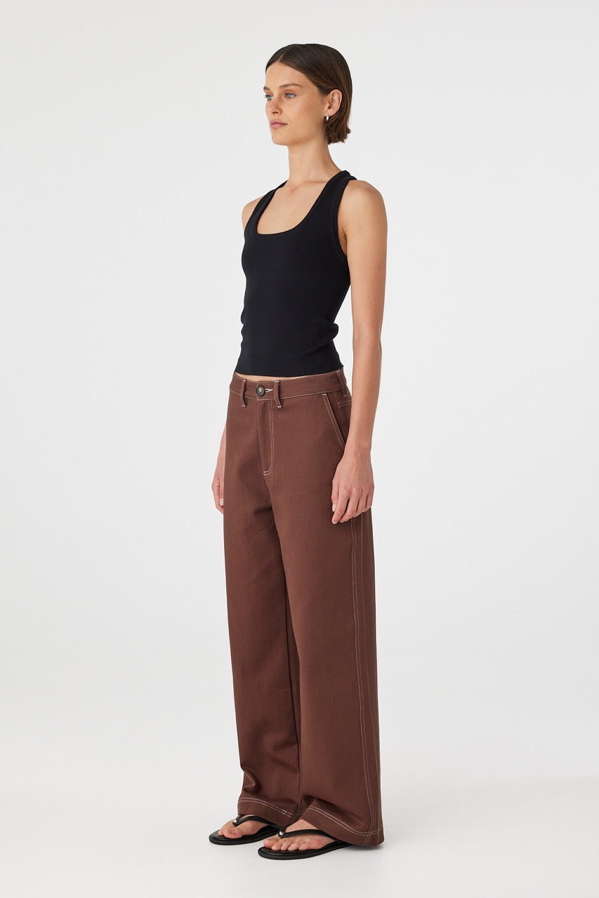 Side outfit view of Tilda Pant espresso, high-waist straight-leg cotton pants showing leg line and drape.
