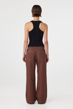 Back view of Sable Top black, racerback silhouette showing shoulder coverage and fit.