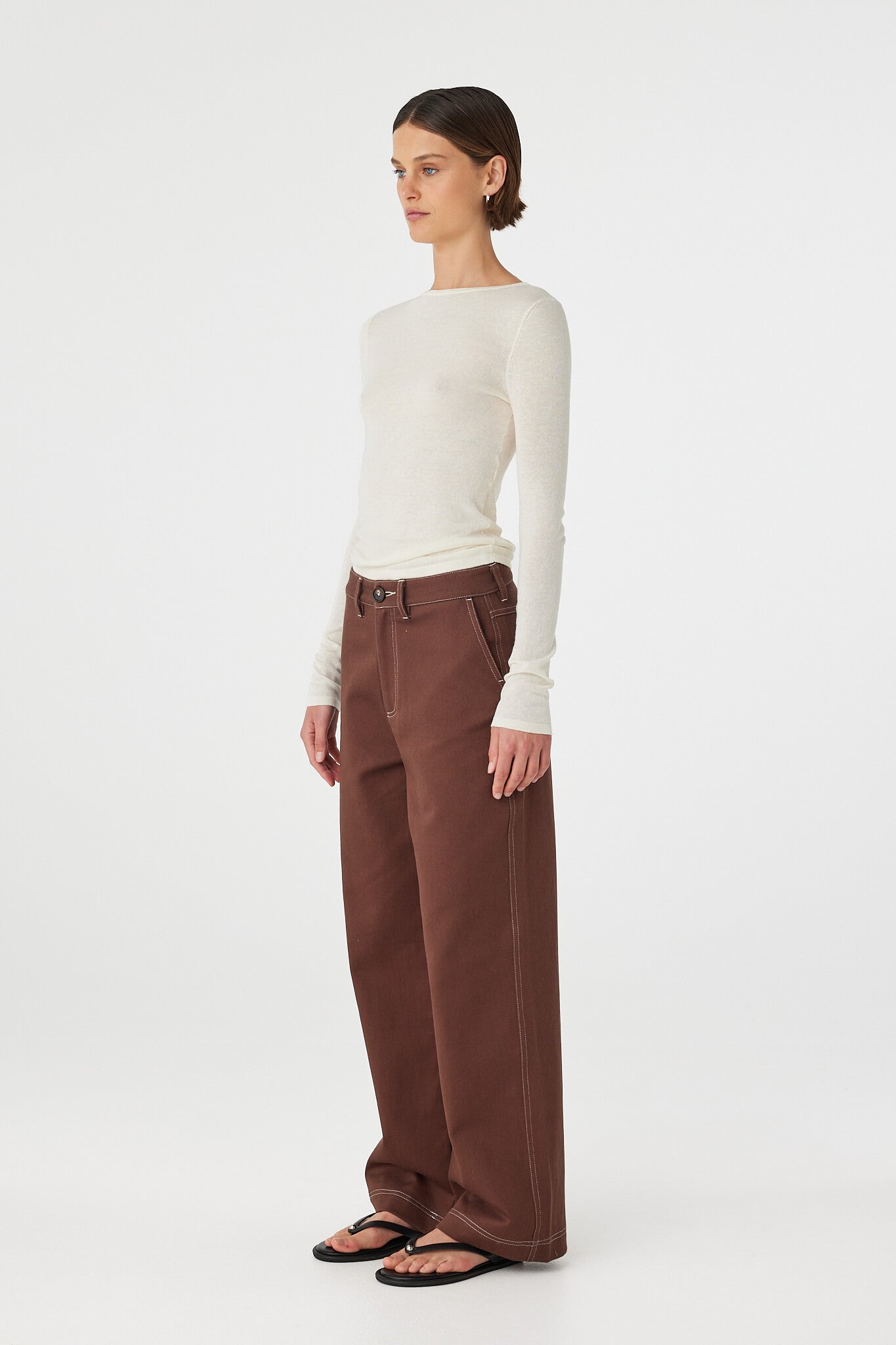 Side view of Aston Top in cream, cotton–linen knit long sleeve with slim fit and boat neckline.