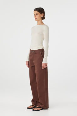 Side view of Aston Top in cream, cotton–linen knit long sleeve with slim fit and boat neckline.