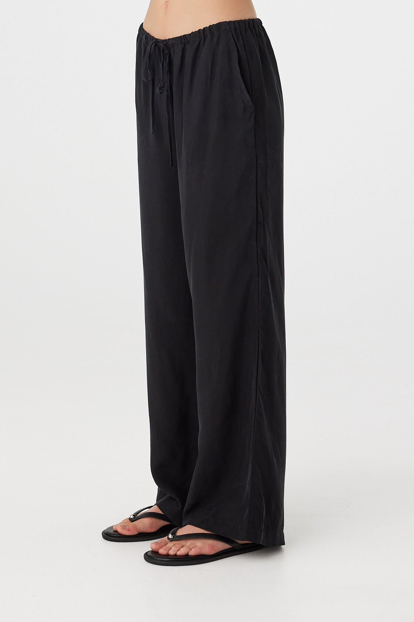 Rae Pant black, straight-leg drapey pants showing full length and fluid fall through the leg, front view.