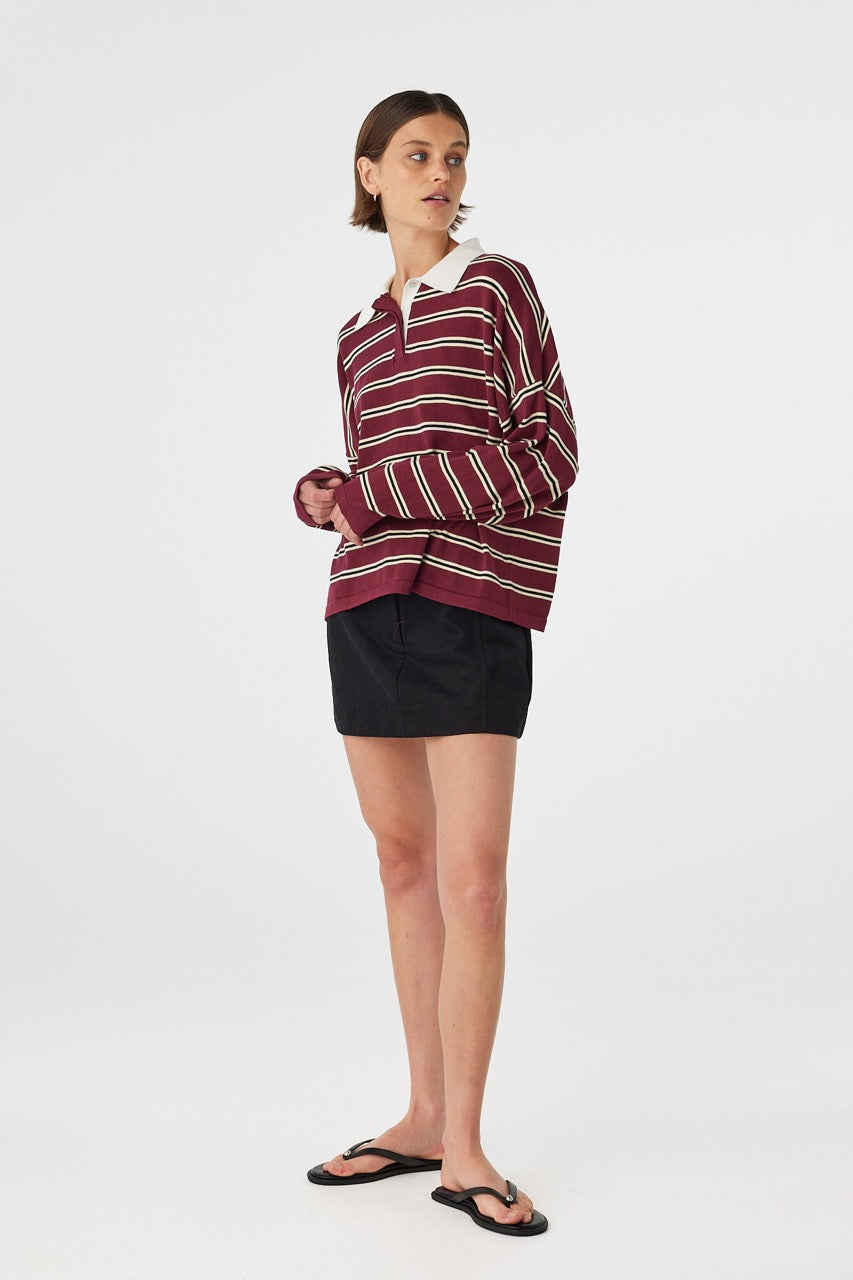 Three-quarter view of Rayne Knit Jersey merlot stripe, oversized striped knit with contrast collar and clean placket.