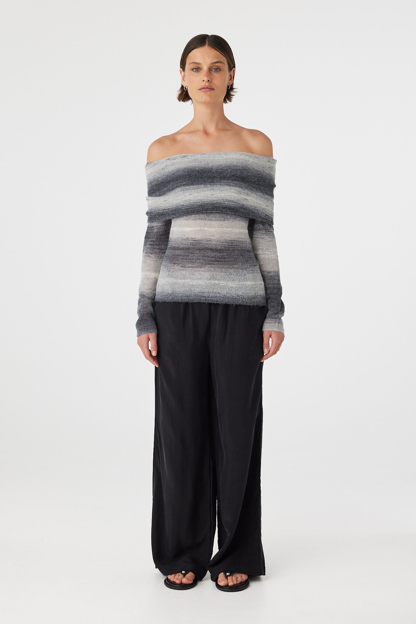 Nikki off the shoulder top in grey and cream ombre knit featuring a soft foldover neckline and fitted silhouette, styled with relaxed black wide leg pants