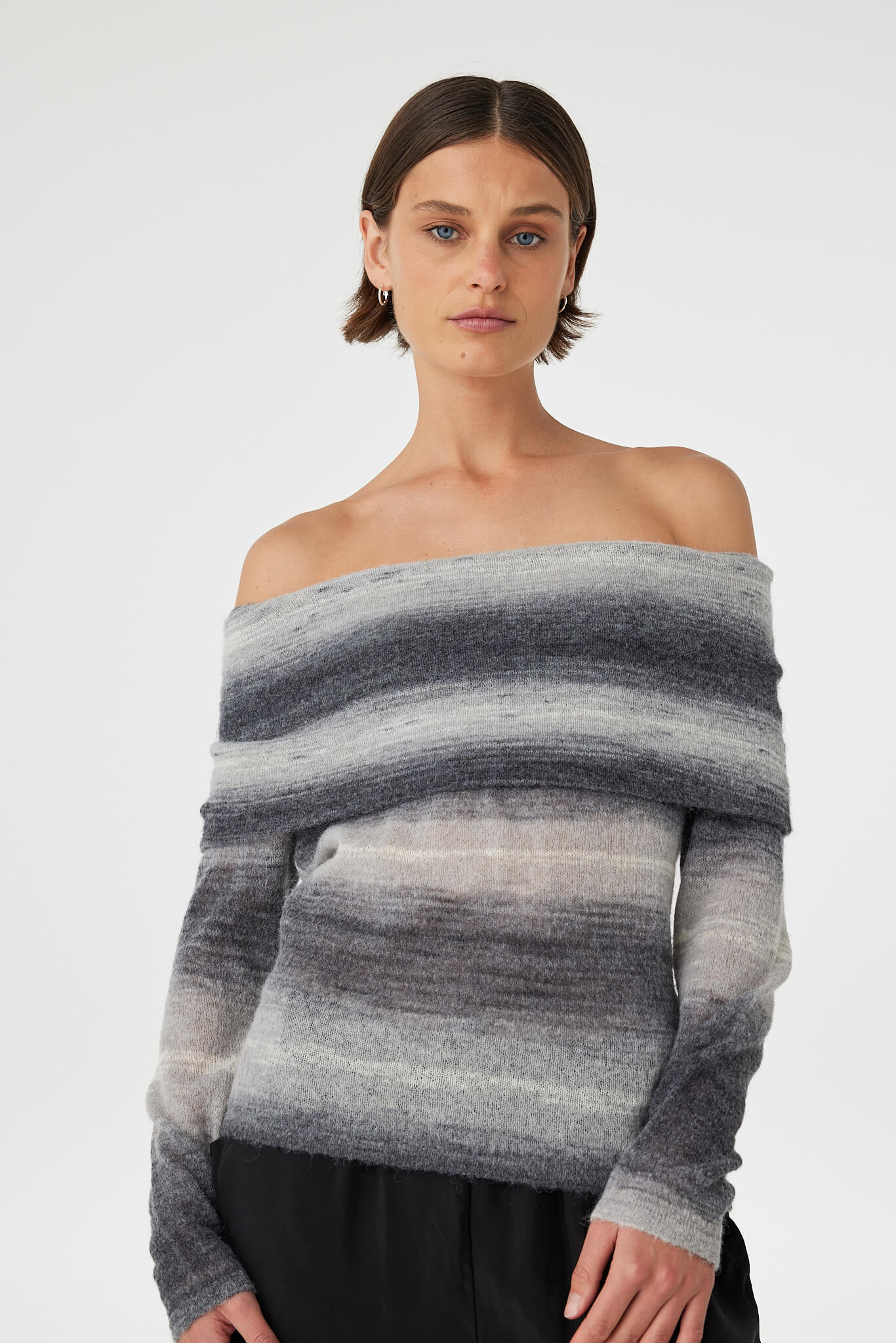 Nikki off the shoulder top in grey ombre knit close-up, featuring a soft fuzzy finish, sheer layering and horizontal colour gradient