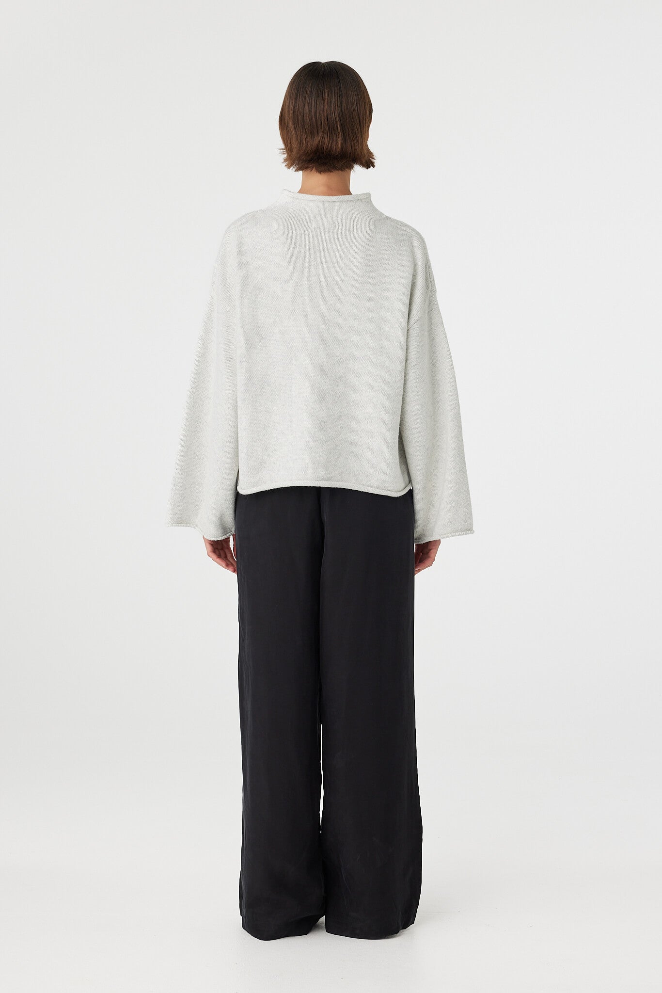 Maeve sweater in snow marle viewed from back, featuring a clean relaxed silhouette and cropped hemline