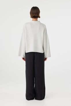 Maeve sweater in snow marle viewed from back, featuring a clean relaxed silhouette and cropped hemline