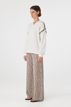 Emmet Pant chocolate & cream side profile showing relaxed straight leg silhouette and soft drape styled with cream top and sandals