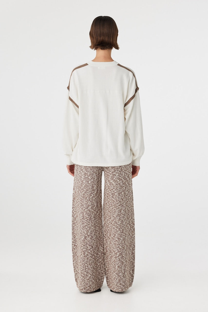 Eden long sleeve tee in cream and espresso viewed from back, featuring a clean oversized silhouette and yoke detail through the upper body, styled with marled wide leg pants