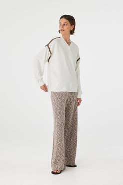Emmet Pant chocolate & cream angled view showing marled knit texture and relaxed fit through the leg styled with cream top and sandals
