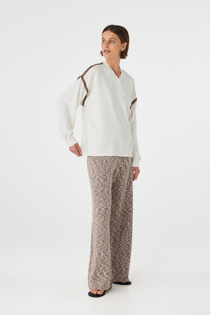 Emmet Pant chocolate & cream angled view showing marled knit texture and relaxed fit through the leg styled with cream top and sandals
