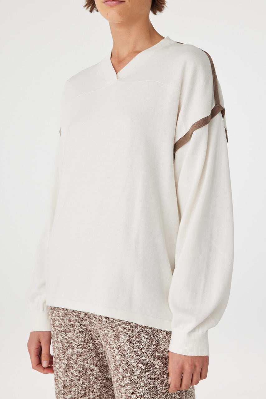 Eden long sleeve tee close-up in cream and espresso, showing the ribbed V-neckline and smooth jersey texture