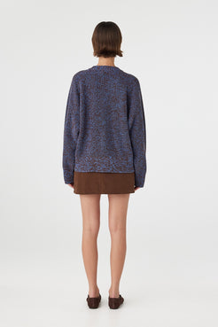 Solene sweater in chocolate and royal blue viewed from back, featuring a clean oversized shape, ribbed hem and sleeves in a chunky mottled cotton knit