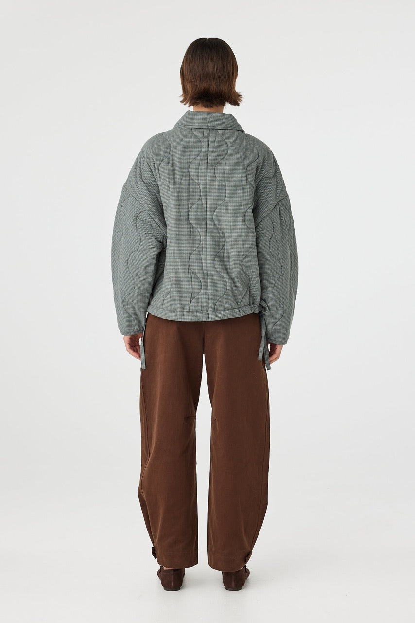 Back view of Matteo Jacket blue check, quilted cotton jacket showing slouchy fit through the body.