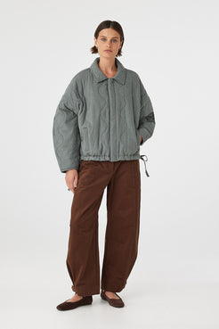 Front view of Matteo Jacket blue check, slouchy quilted cotton jacket with concealed button front.
