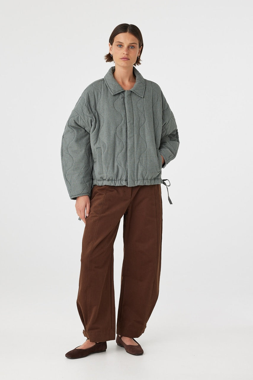 Front view of Matteo Jacket blue check, slouchy quilted cotton jacket with concealed button front.