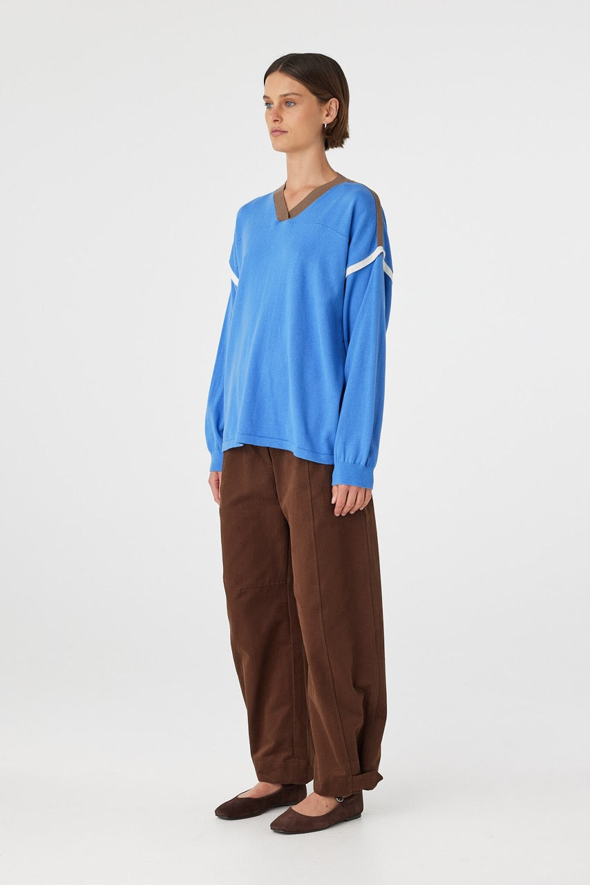 Eden long sleeve tee in royal blue and espresso shown in side profile, highlighting dropped shoulders, wide sleeves and relaxed drape
