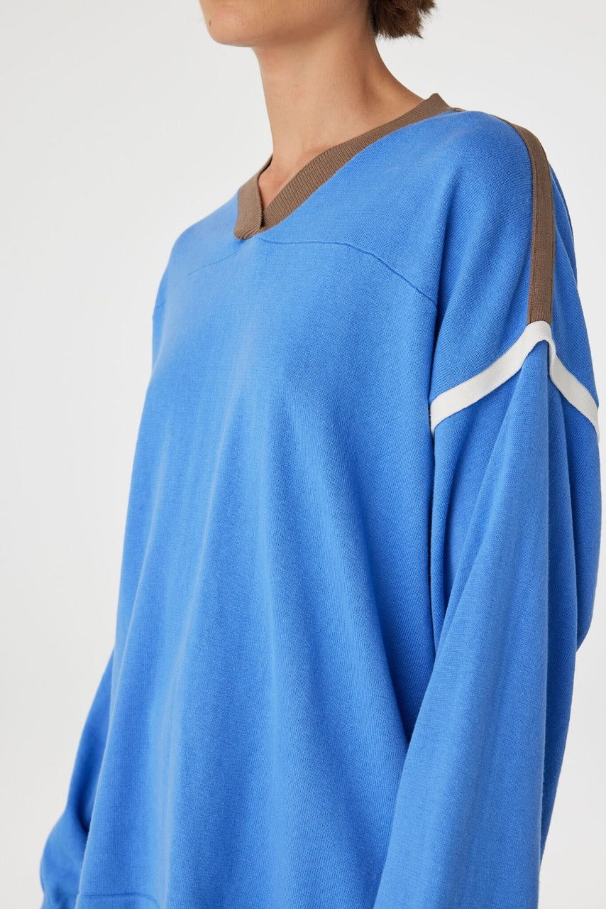 Eden long sleeve tee close-up in royal blue and espresso, showing the ribbed V-neckline and smooth jersey texture