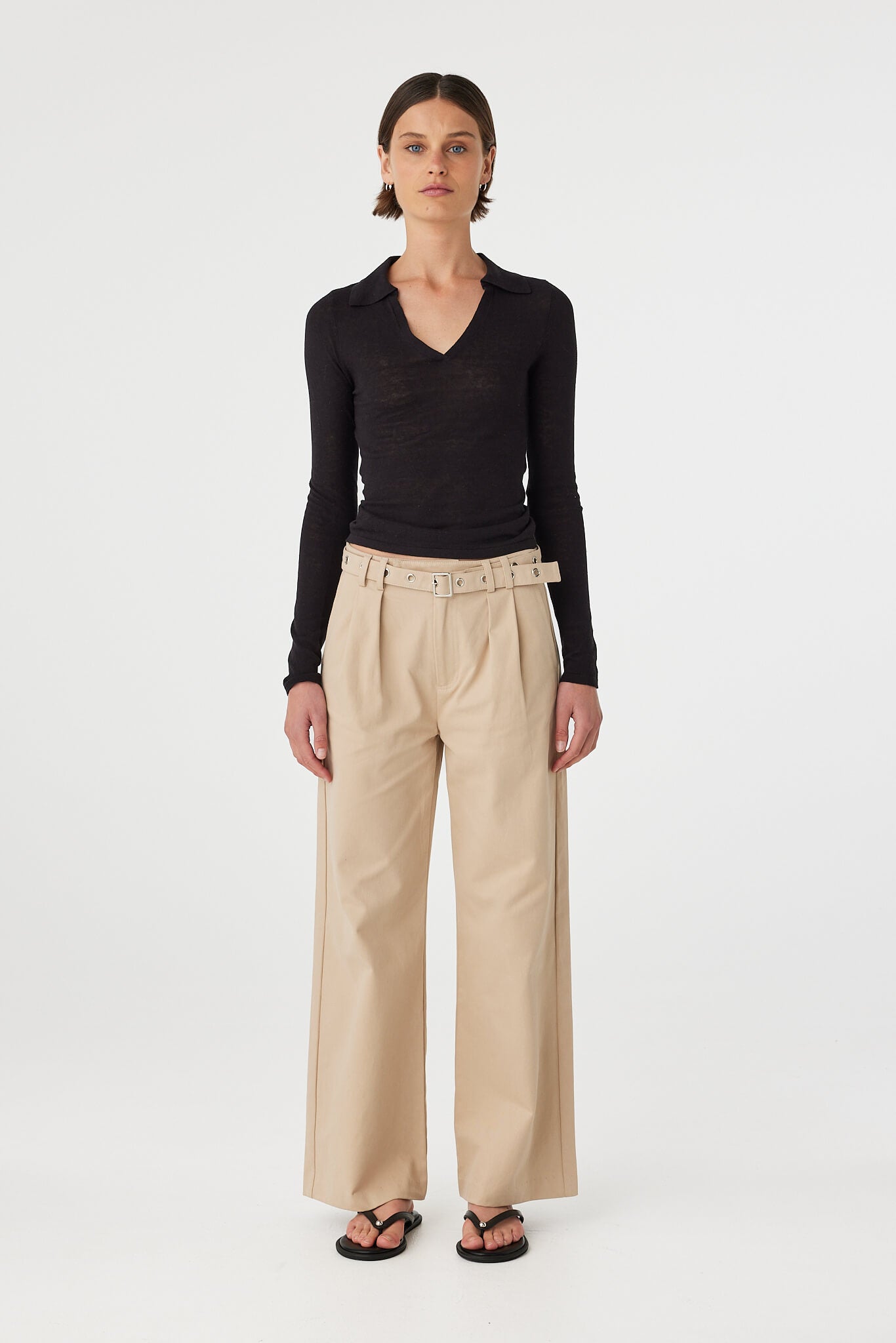 Soraya Pant taupe full outfit front view styled with sheer black long sleeve top and flat sandals