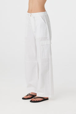 Utility-inspired 100% cotton pant seen from the side, with clean tailoring and subtle texture in a summer-weight fabric.