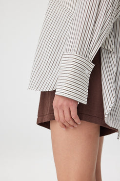 Close view of striped shirt cuff showing oversized cuff detail