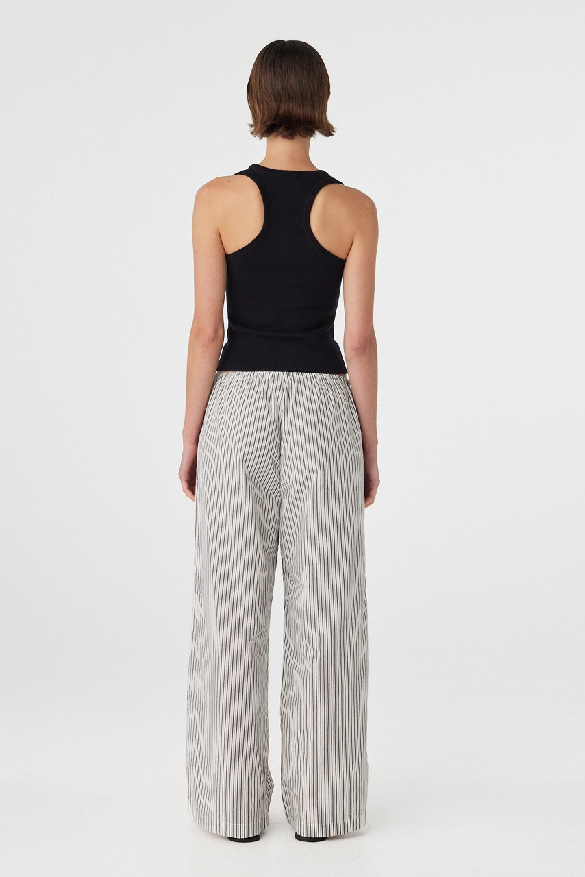 Back view of black and white striped cotton pants with relaxed fit