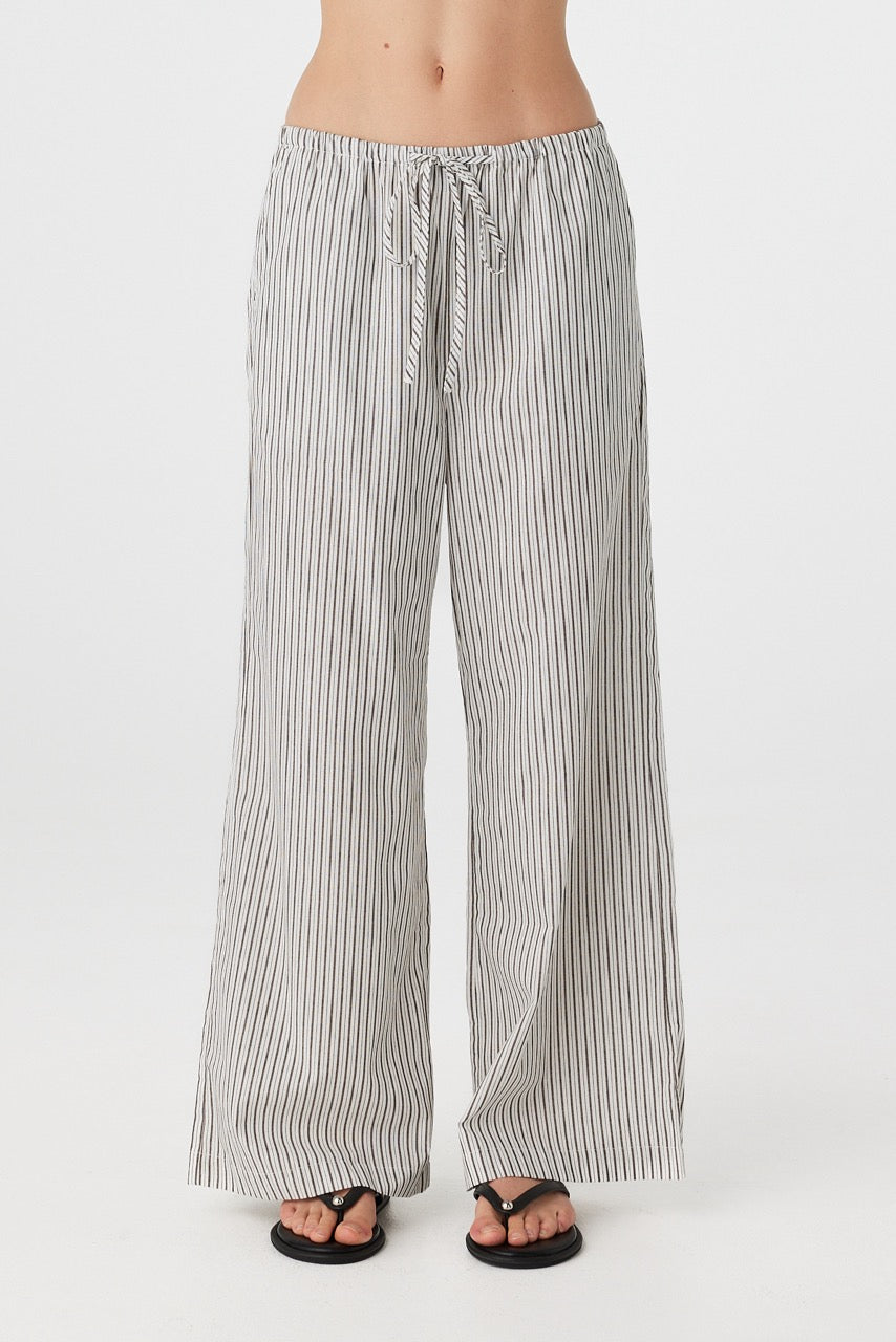 Close front view of striped straight-leg pants showing elastic waistband with drawcord