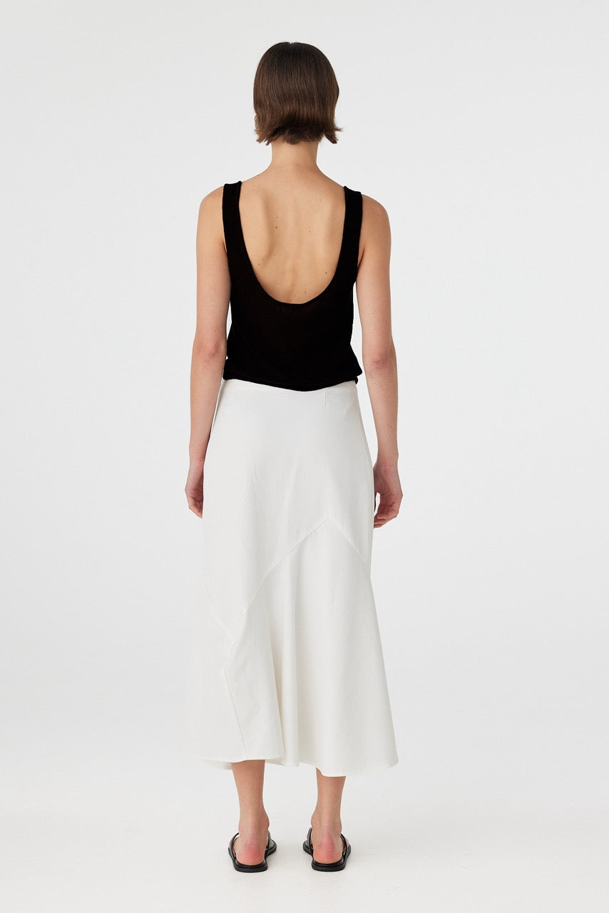 Back view of black cotton knit tank featuring low open back and soft drape.