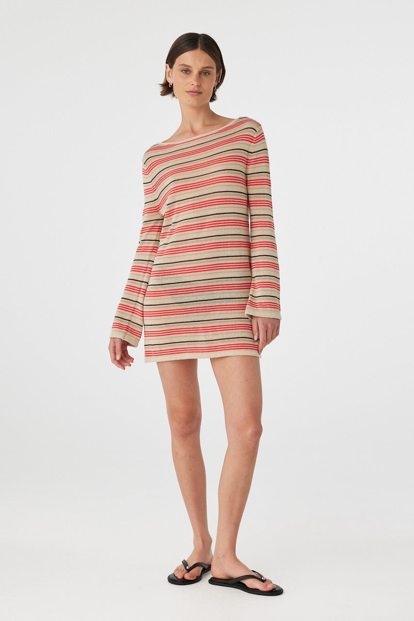 Front view of model wearing sheer striped mini dress with long sleeves and boat neckline