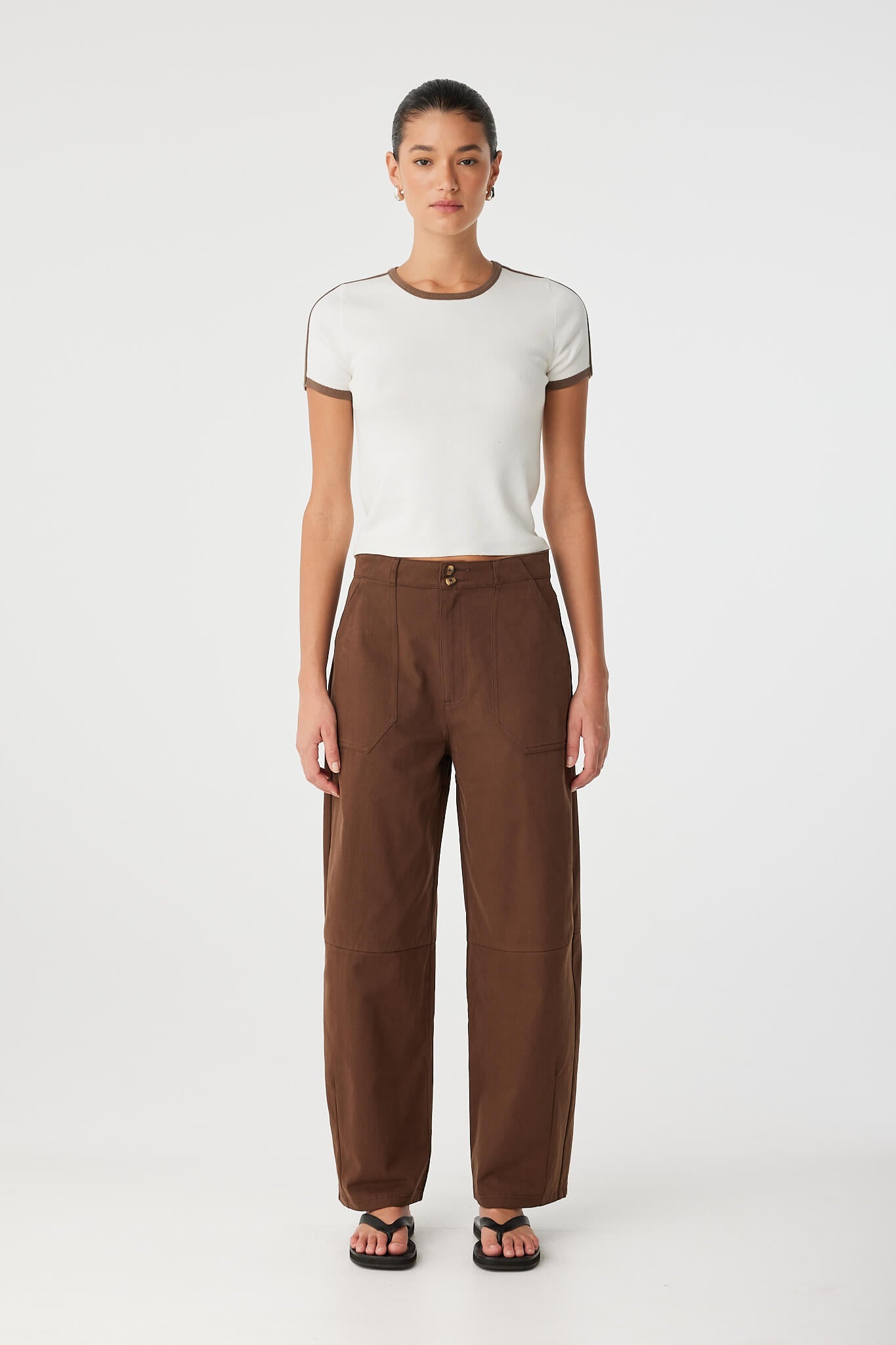 Full-body view of Mischa Tee styled with high-rise pants, soft fit and athletic stripe detail.