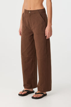 Side view of relaxed-fit cotton pant with soft barrel leg and natural drape.
