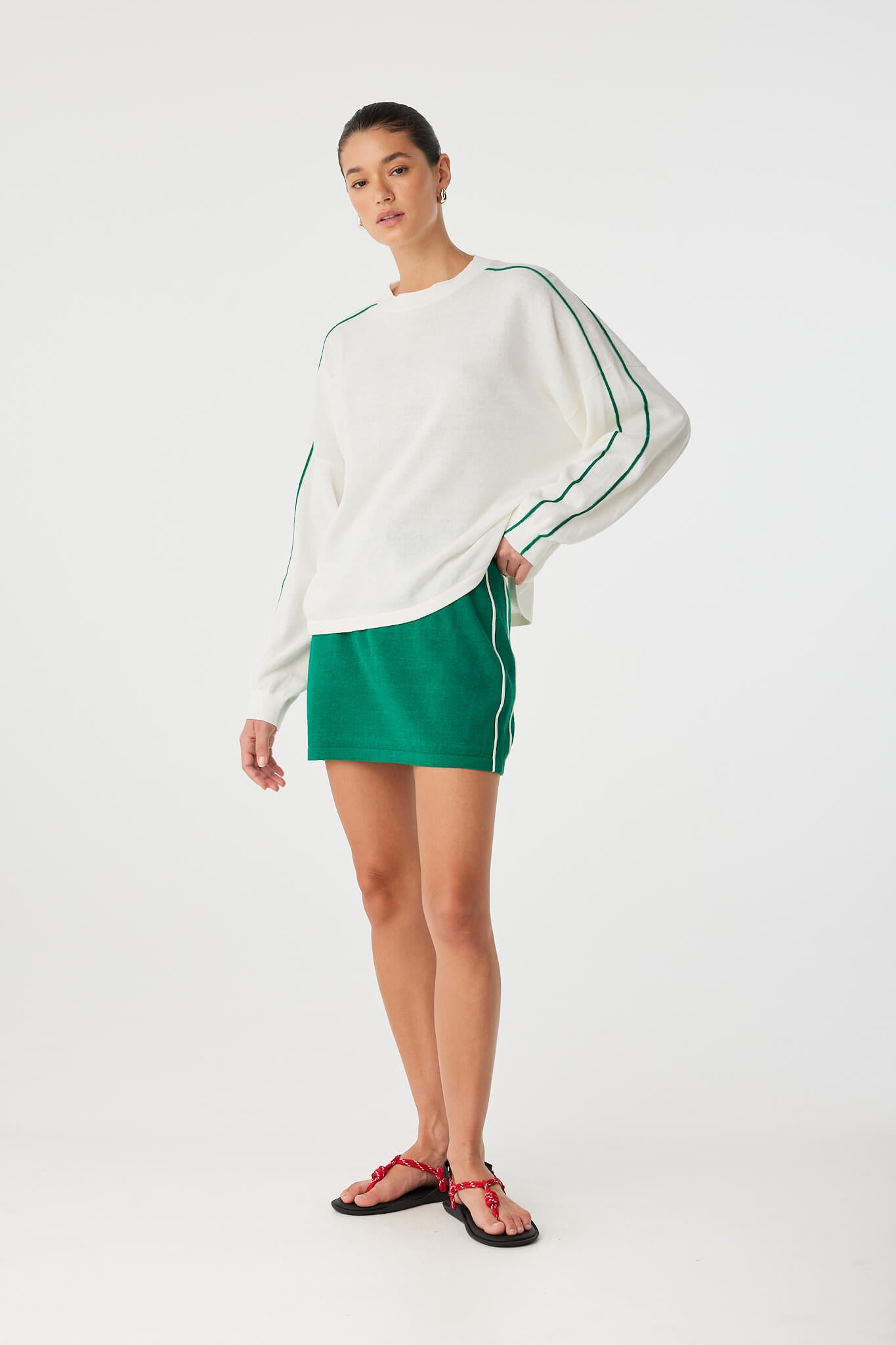 Model in relaxed pose wearing Pippa Long Sleeve with contrast stripe and dropped shoulder.