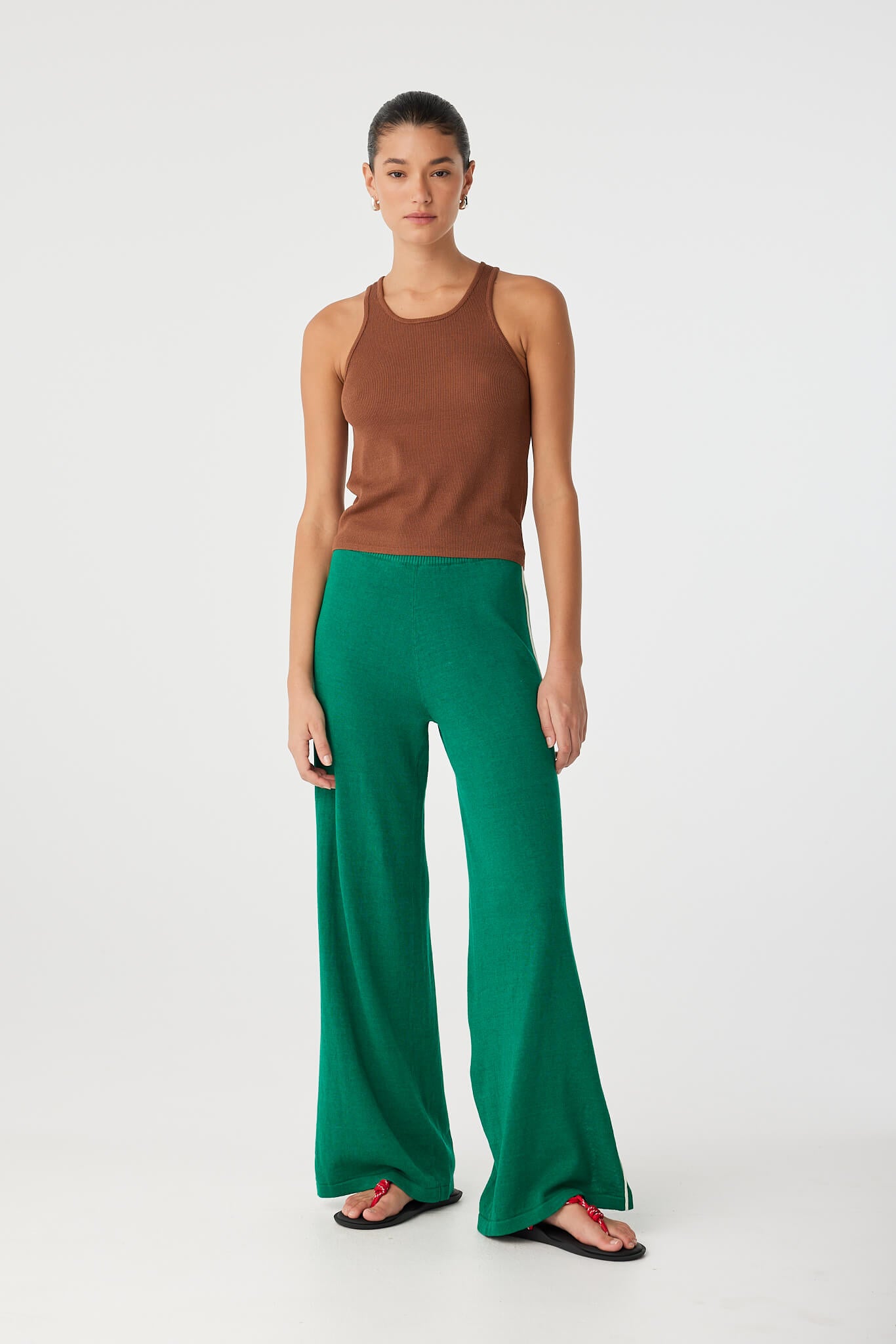 Model wears sculpted clay tank with fine rib texture and soft sheen.