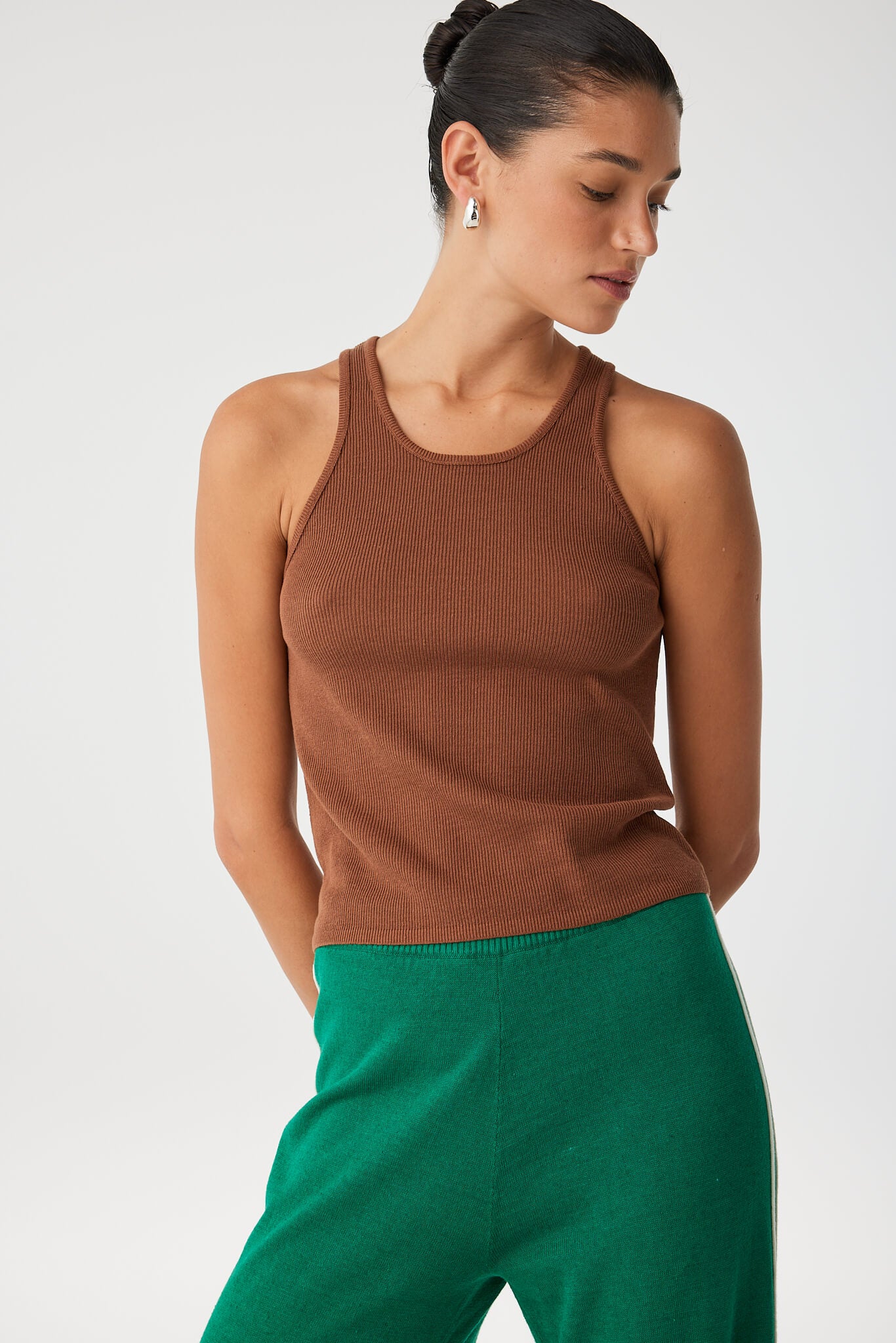 Side view of Rio Tank showing racerback cut and sculpted rib texture in clay tone.